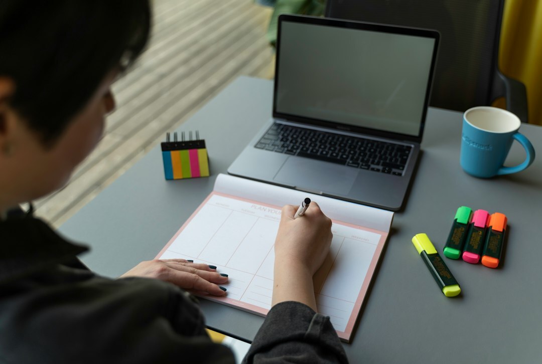 writer at desk with notebook